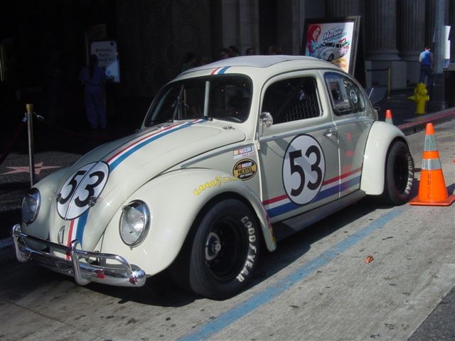 16 Woodie races Herbie